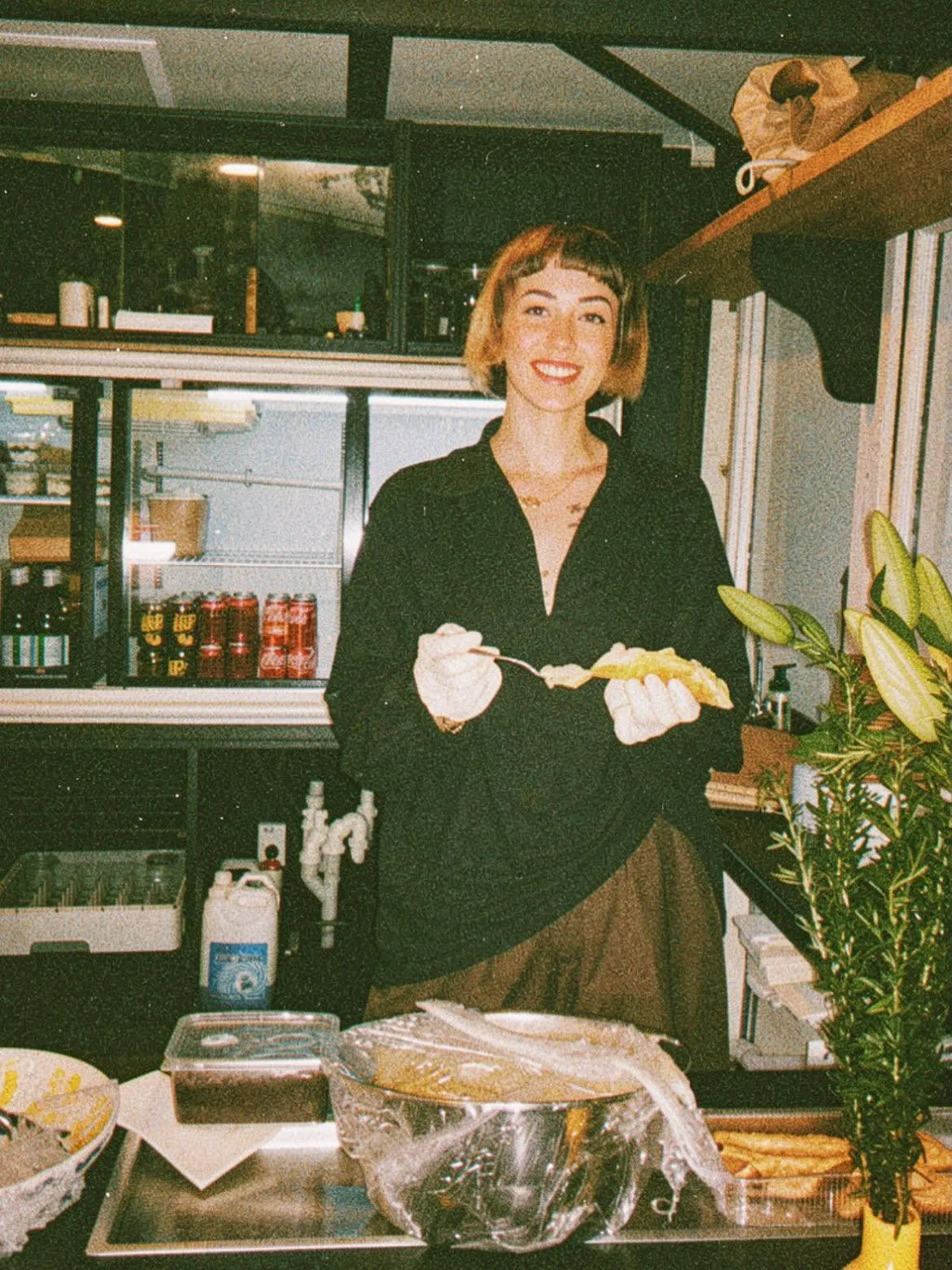 Paradiso team member serving cannoli behind the counter