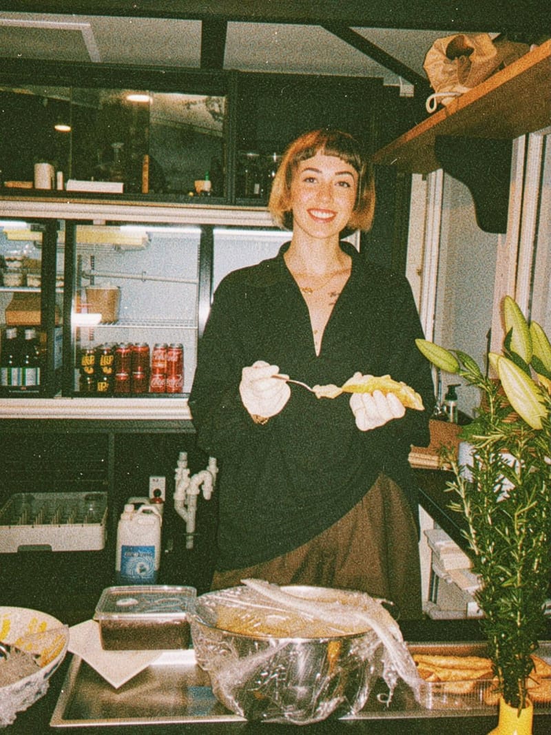 Paradiso team member serving cannoli behind the counter